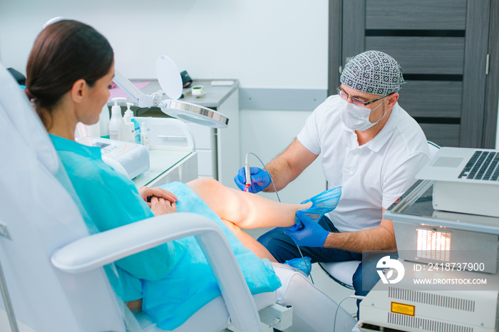 Young female undergoing laser spider veins removal