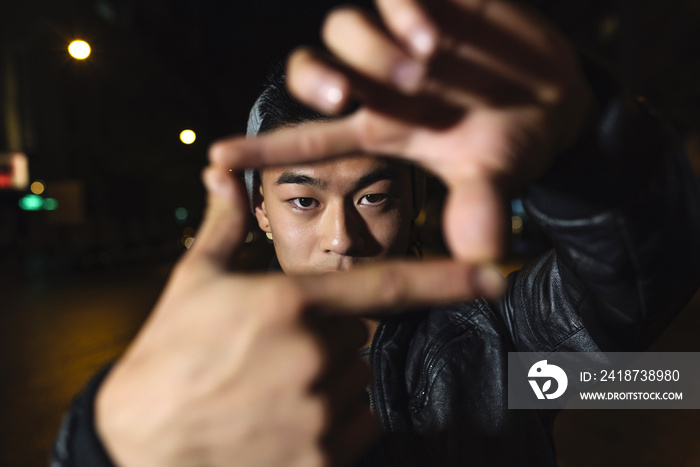 Portrait of a asian young man in the city.