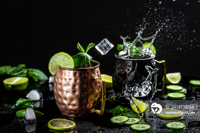 Moscow mule cocktail with lime, mint and cucumber splashes and ice frozen motion