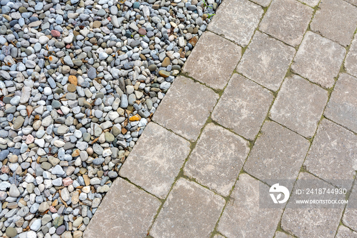 Tumbled paver walkway in the garden with mulch create an interesting landscaping abstract background