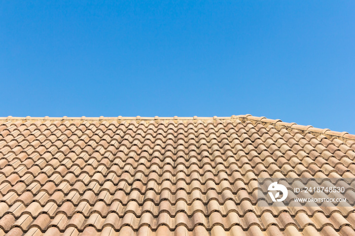 View of roof tiles and blue sky on the background