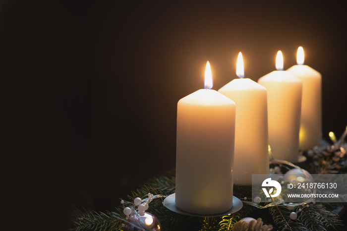 Fourth advent, four candles - candlelight on dark brown panorama background - advent banner. Horizon