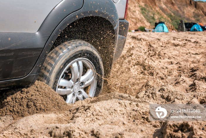 the car got stuck in the deep sand