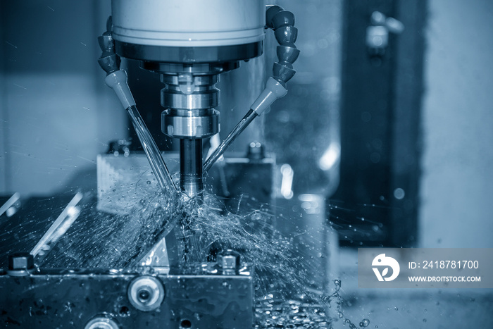 The CNC milling machine cutting the  mold parts with oil coolant method.