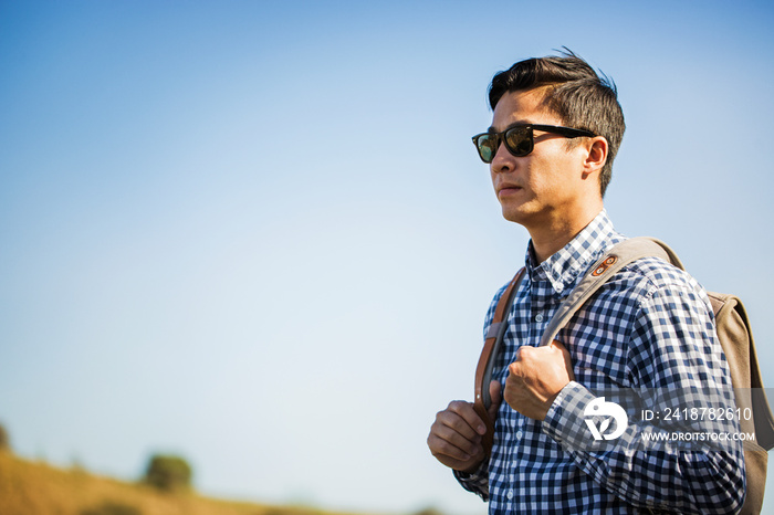 Hiker standing against clear sky