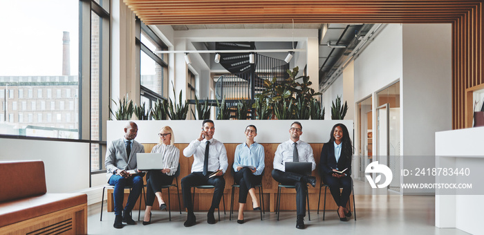 Diverse businesspeople working in the reception area of an offic