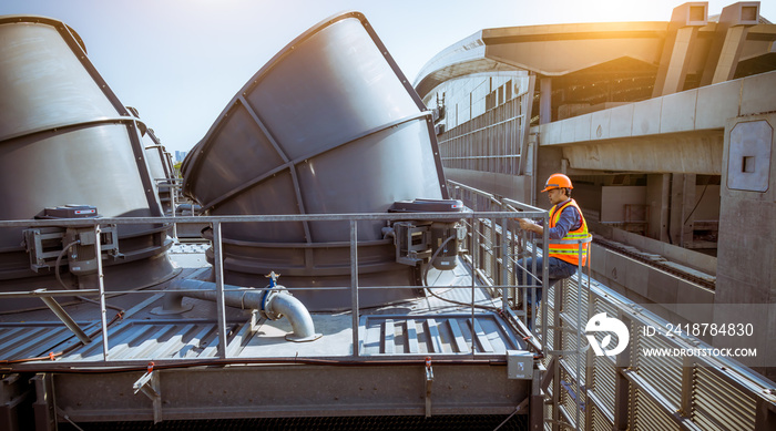 Engineer under checking the industry cooling tower air conditioner is water cooling tower air chille