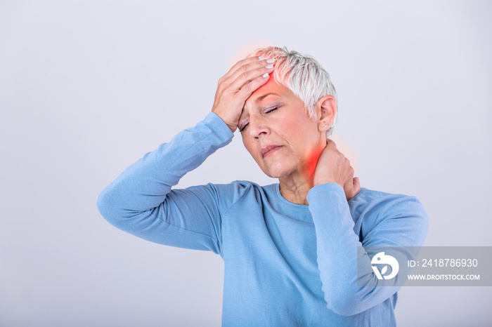 Attack of the monster migraine. Sinus pain. Unhappy Retired Senior Woman holding her head with pain 