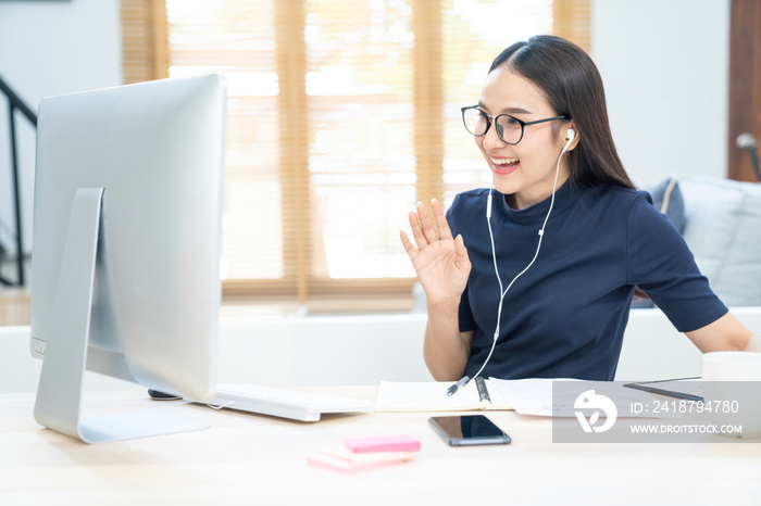 Asian business woman talking to her colleagues about plan in video conference. Business team using c