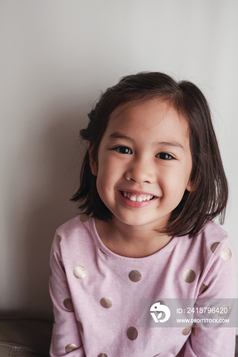 Portrait of happy Asian young girl smiling