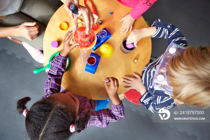 Children (4-5) playing with toys