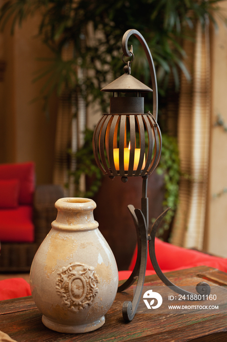 Close-up of a pot with candle lantern on table at home; Scottsdale; USA