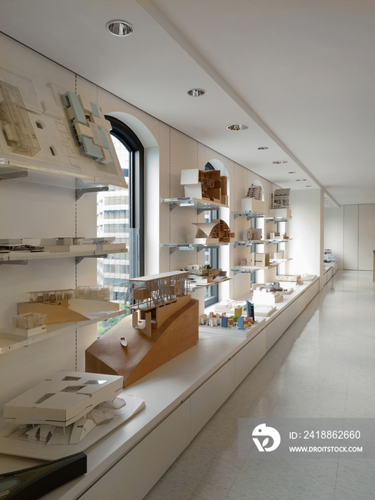 Architectural building models display on shelves of office