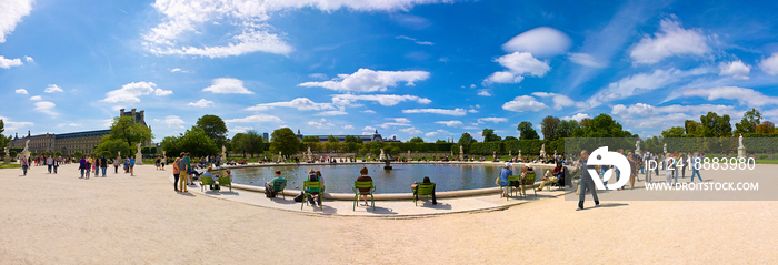 People relaxing at Tuileries Garden in Paris, France