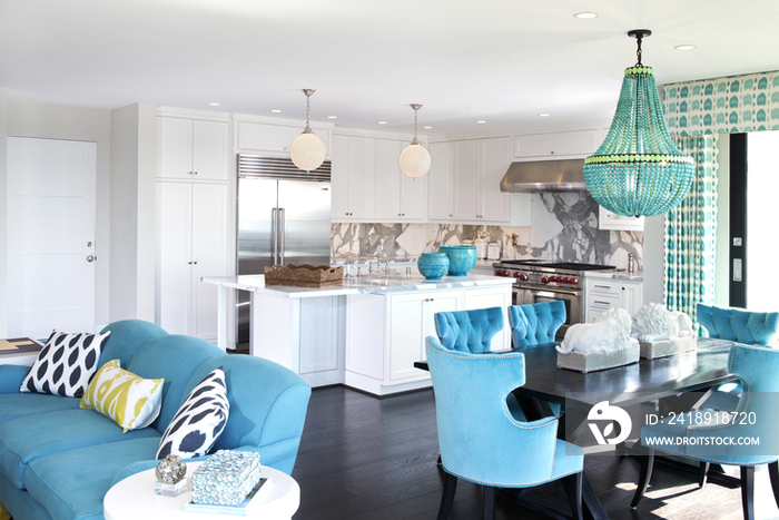 Open plan kitchen and dining area with sofa in contemporary house; California; United States of Ame