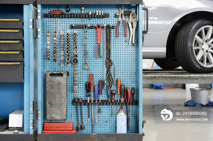 Close-up of a variety of tools on a blue board