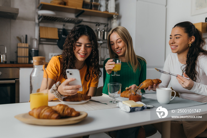 Female friends are hanging out in the kitchen