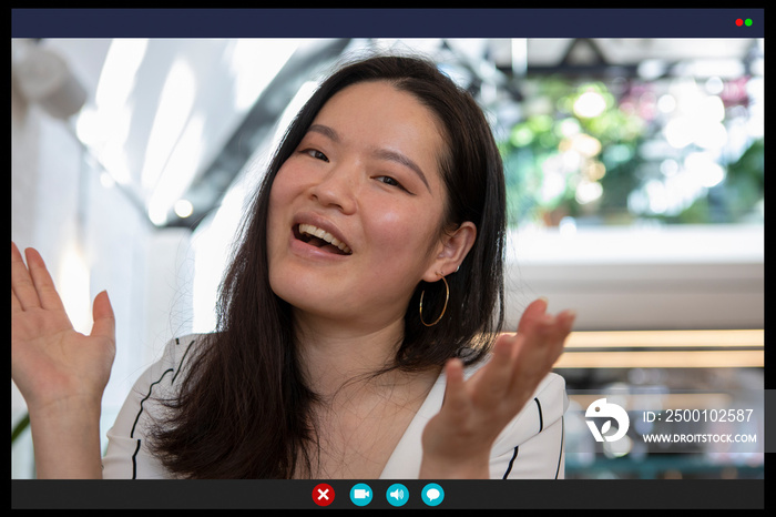 Smiling woman gesturing in video call