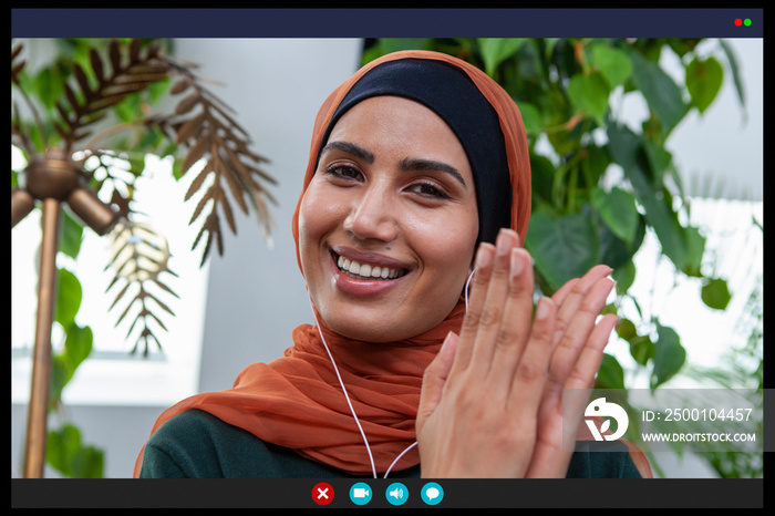 Smiling woman clapping in video call