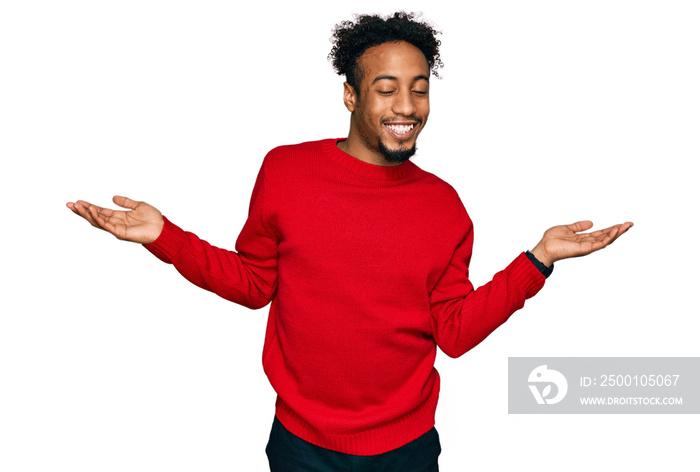 Young african american man with beard wearing casual winter sweater smiling showing both hands open palms, presenting and advertising comparison and balance