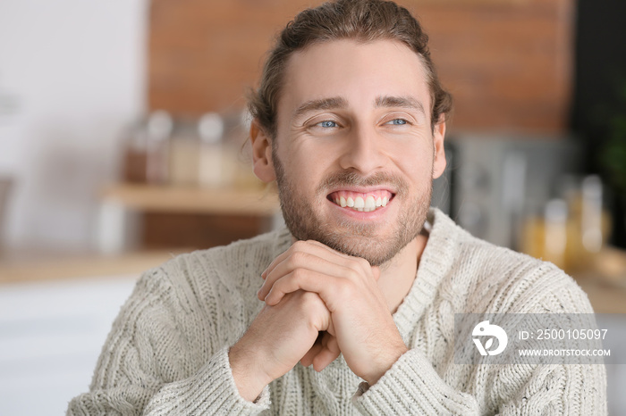 Smiling young man at home