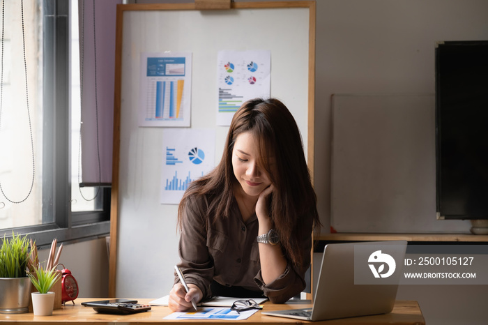 Businesswoman or Accountant hands holding paperwork with calculator, account and saving concept.