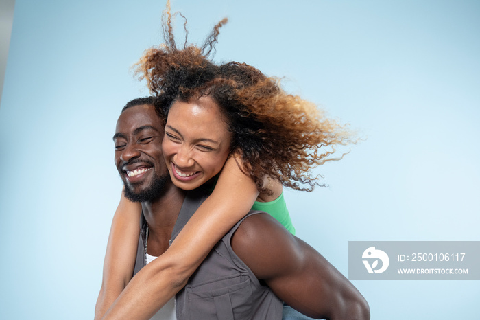 Laughing couple embracing