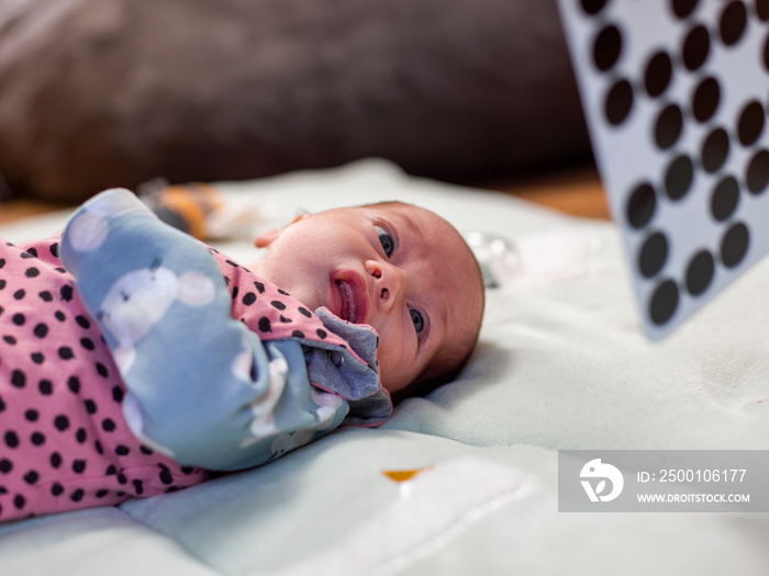 Infant girl   lying on blanket