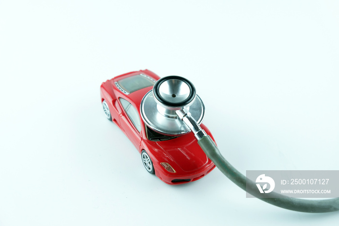 Stethoscope checking up the car on white background, Concept of car check up, repair and maintenance..