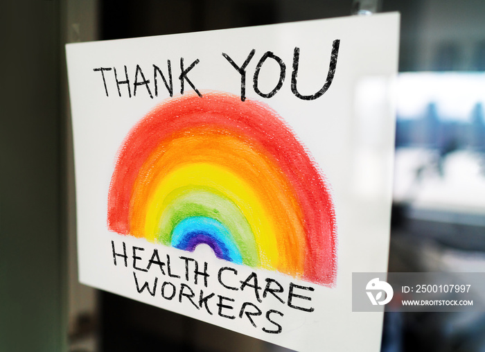 THANK YOU Healthcare workers child’s painting hanging at window as appreciation support message for doctors and nurses fighting COVID-19 at hospitals.