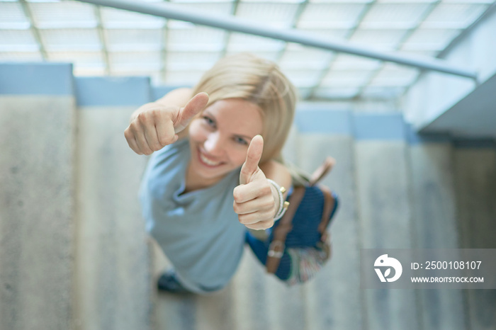 woman climbing stairs indoors