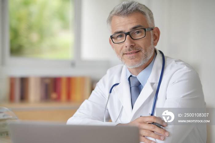 Portrait of confident doctor in office