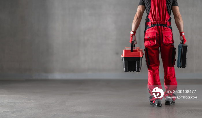 Professional Caucasian Worker with Toolboxes in His Hands