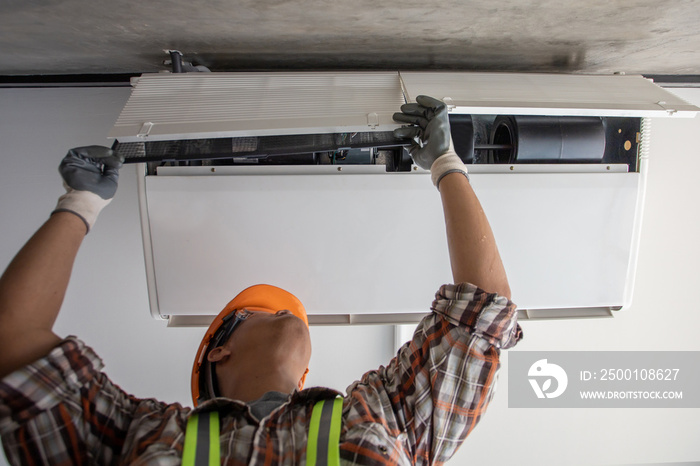 Air Conditioning Technician and A part of preparing to install new air conditioner. Technician vacuum pump evacuates and checking new air conditioner