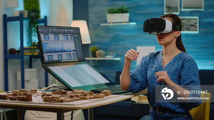 Woman architect using vr glasses for construction development. Engineer with headset working with virtual reality to design building model and maquette. Architectural work project