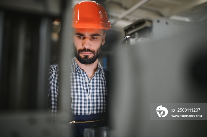 modern industrial machine operator working in factory