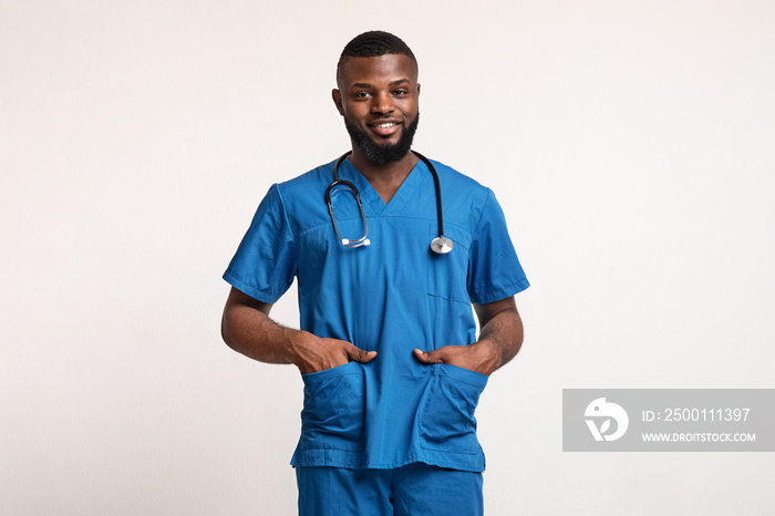 Black guy intern with hands in pockets over white