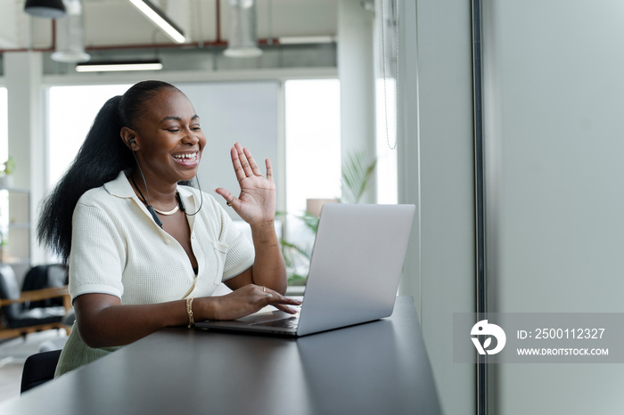 Businesswoman with laptop working in modern office