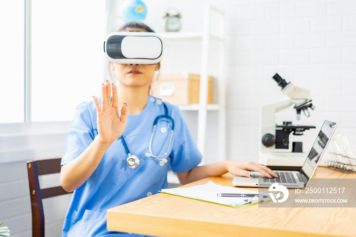 Asian female doctor wearing virtual reality glasses (VR box) testing result with simulator Mixed media futuristic medical interface, Future Innovative technology science medicine Medical concept