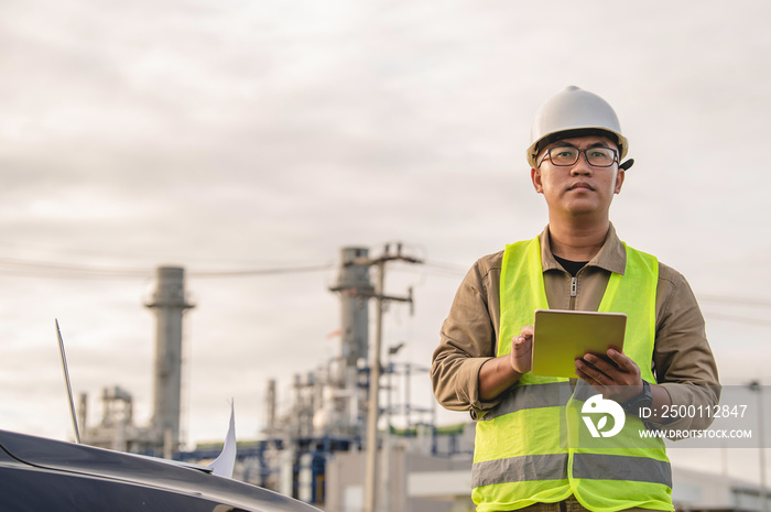 Asian man petrochemical engineer working at oil and gas refinery plant industry factory,The people worker man engineer work control at power plant energy industry manufacturing