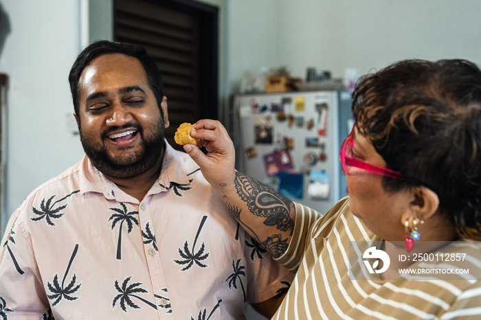 Plus sized parents making a healthy meal for the family