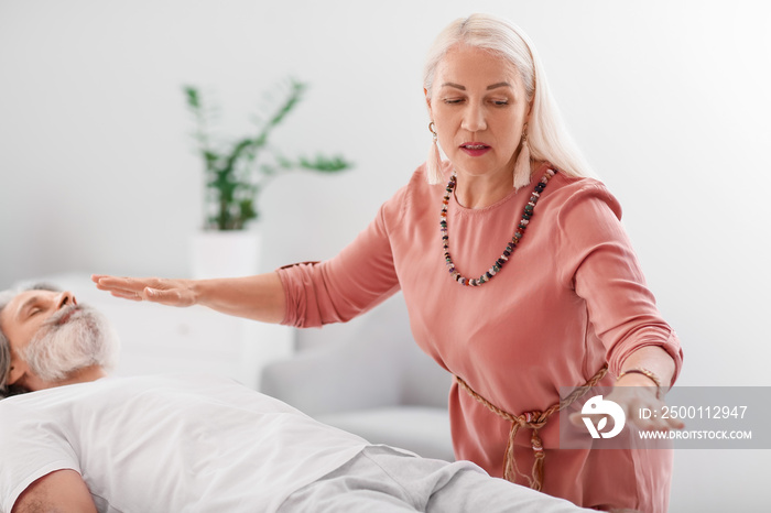 Reiki master working with patient