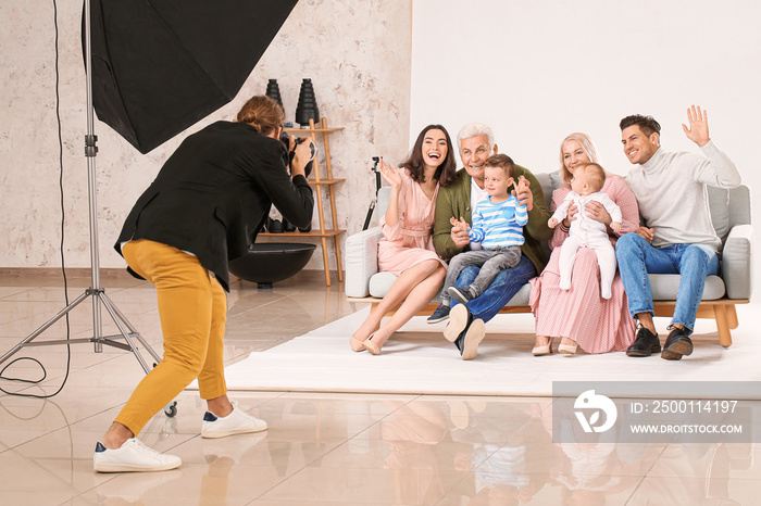 Photographer working with family in studio