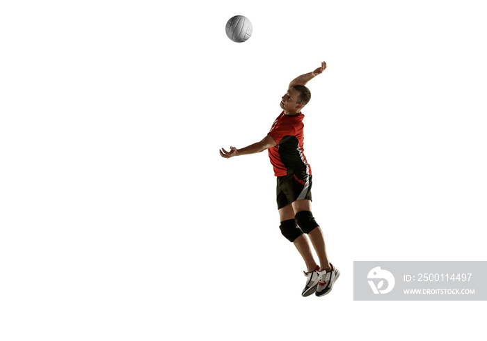 Young caucasian volleyball player placticing isolated on white background. Male sportsman training with the ball in motion and action. Sport, healthy lifestyle, activity, movement concept. Copyspace.