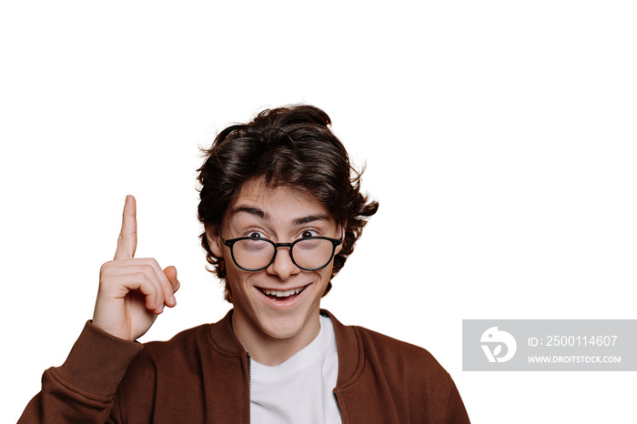 Eureka! Smart Spanish boy in white t-shirt and brown jacket pointing up by index finger at empty space on transparent background. Intelligent caucasian teenager in glasses looks at camera. Mockup.