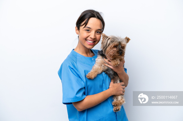 Young veterinarian woman with dog isolated on white background smiling a lot