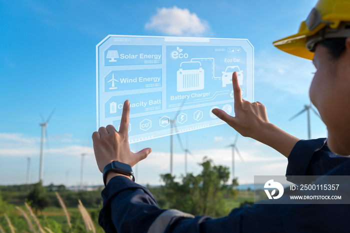 Close up engineering woman hand is touching virtual reality Analytics engineering data in a field over electrical turbines background