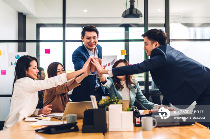 Successful of group asian professional business people to win of celebrating project success.Creative business happy and enjoy gesture hand high five good teamwork together at office workloft