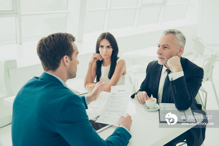 Business people in formal wear having meeting and discussing new