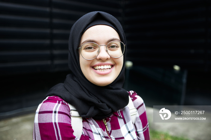 Portrait of a young Arab student smiling